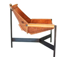 The Home Chair is a handcrafted accent chair built from blackened mild steel and harness leather